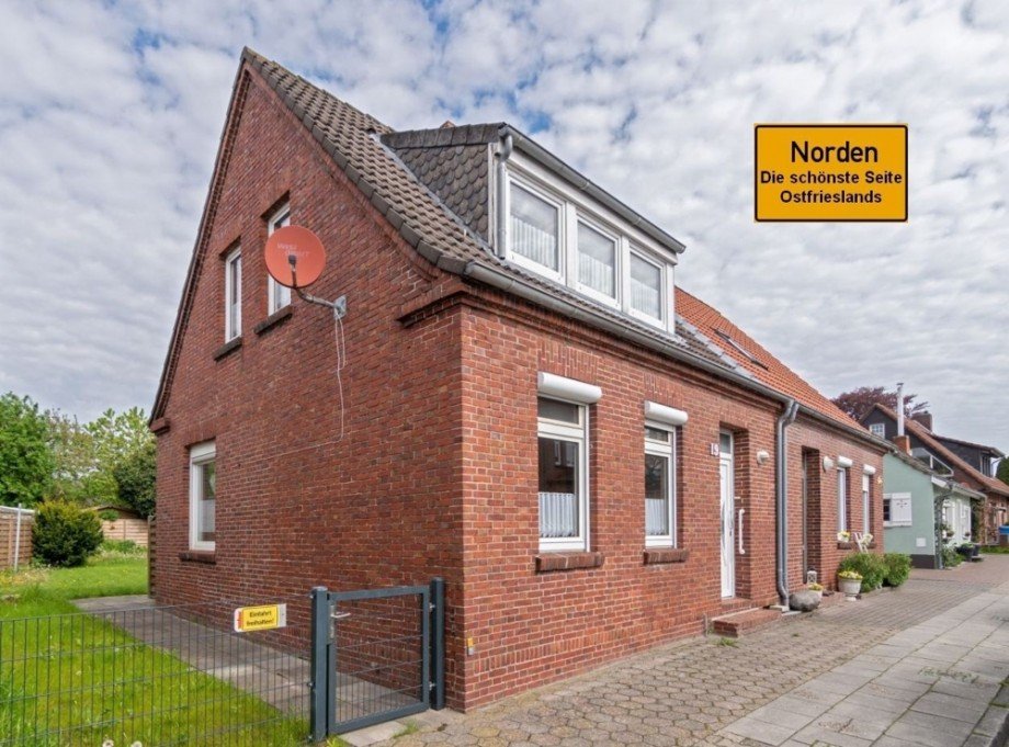 7846 Titelbild mit Ortsschild Doppelhaush�lfte Norden