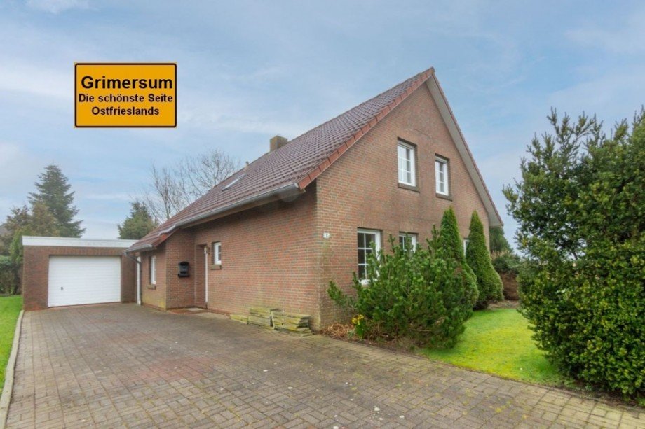 7889 Titelbild mit Ortsschild Einfamilienhaus Krummh�rn / Grimersum
