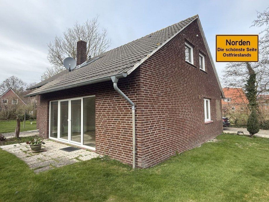 7973 Titelbild mit Ortsschild Erdgeschosswohnung Norden