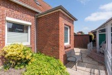 7849 Seitenansicht Ostfriesischer Wohnklassiker mit Garage in bester Lage zwischen Norden und Norddeich!