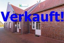 7870 Titelbild mit Ortsschild verkauft Attraktive Erdgeschosswohnung mit geschmackvollem Ambiente in strandnaher Lage von Norddeich!
